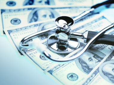 United to End MND disappointed by no U.K. government funding/ALS News Today/image of money with stethoscope