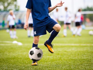 head strikes in soccer | ALS News Today | person playing soccer