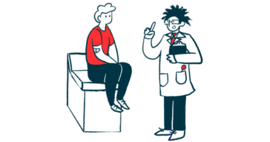 A clinician holding a clipboard gestures while speaking to a patient sitting on an examining table.