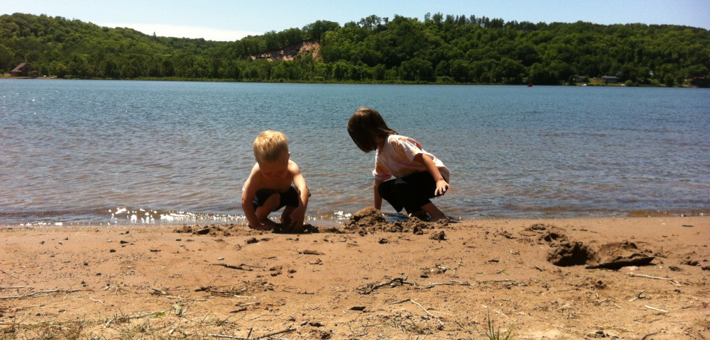 taking risks | ALS News Today | photo of two children just in the water on a shoreline