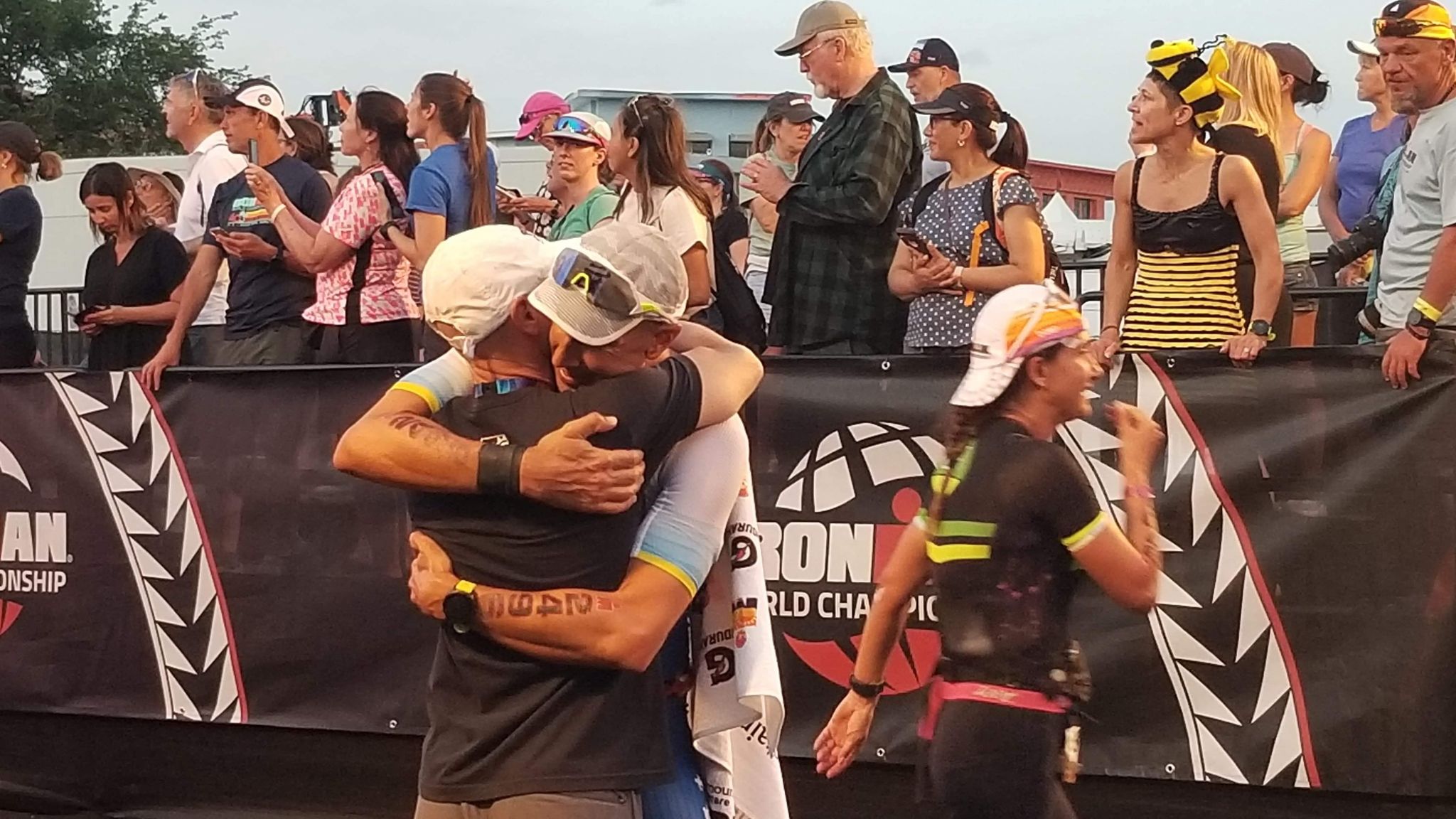 Ironman World Championship | ALS News Today | Kyle Brown and Patrick Harfield embrace at the end of the Ironman competition