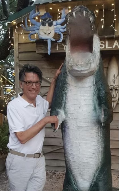 Ned Patterson with alligator statue