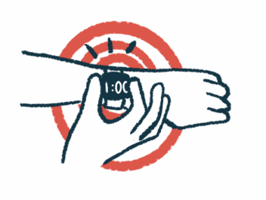 A person pushes a button on a smartwatch.