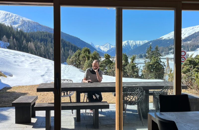 Albert at table with snow mountain view