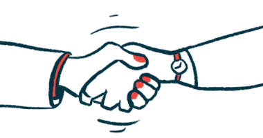 Two hands are seen clasped together in a close-up view of a handshake.