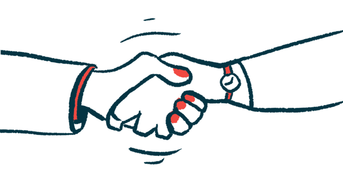 Two hands are seen clasped together in a close-up view of a handshake.