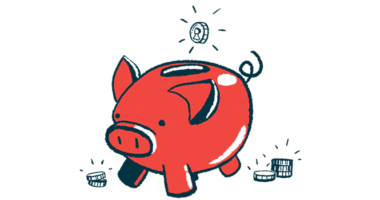 A coin is seen poised over the top slot on a red piggy bank.