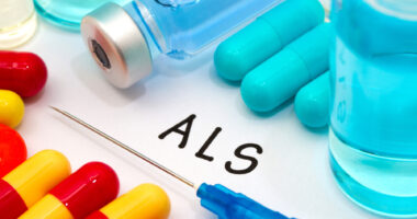 Medications and vials on to top of paper that says ALS