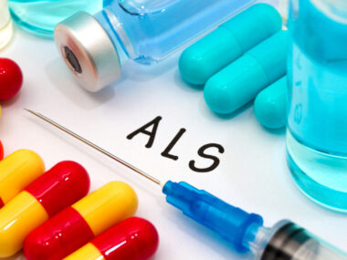 Medications and vials on to top of paper that says ALS