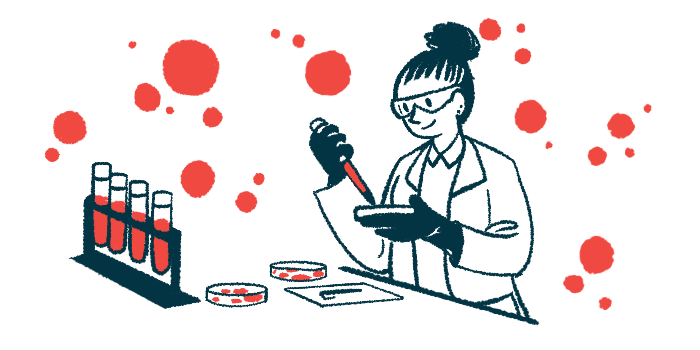 A researcher in a lab uses a dropper to apply material to a petri dish.