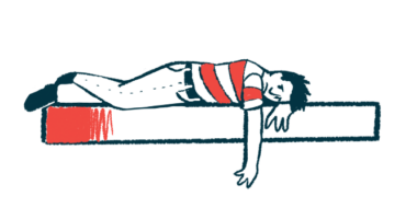 A man lies face down on a bed, depressed.