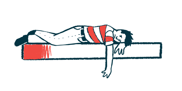 A man lies face down on a bed, depressed.