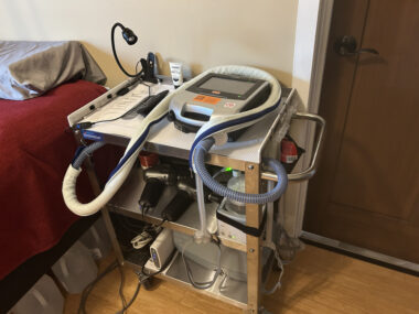 A photo shows a set of shelves with medical equipment on it.