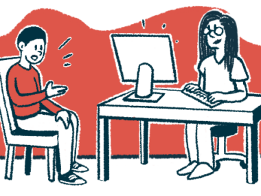 A patient sits in a chair speaking to a doctor at a desk.